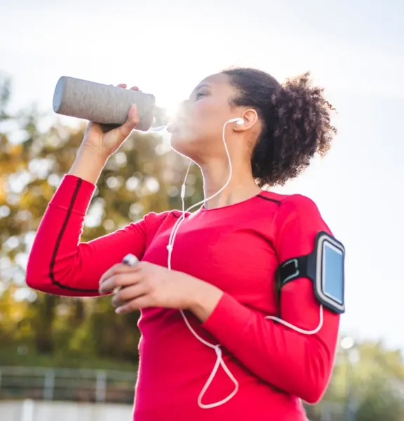 girl drinking water after